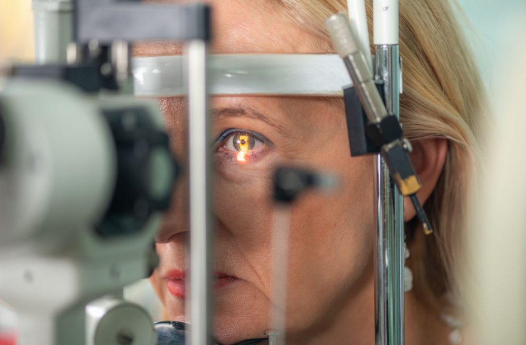 A close-up image of an older patient's eyes during an eye pressure test to check for glaucoma.