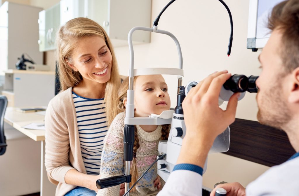 Optometrist performing a vision test in Calgary to check for 20/40 vision using an eye chart and phoropter.